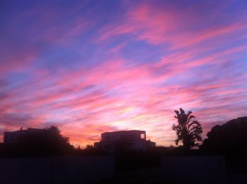 Silhouette of built structure at sunset