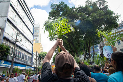 
catholics are seen participating in the palm sunday procession in the city of salvador, bahia.