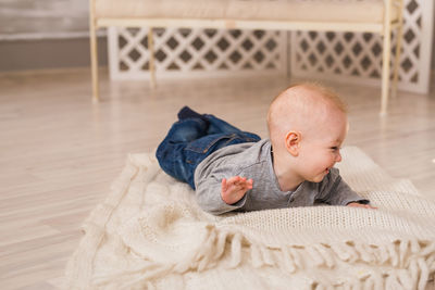 Cute boy lying on sofa