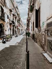 Footpath amidst buildings in town