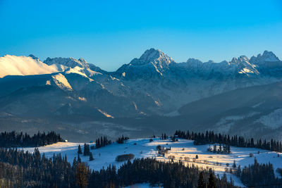 Scenic view of snowcapped mountains against sky