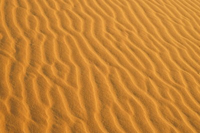Full frame shot of sand at sandy beach