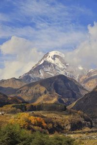 Scenic view of snowcapped mountains against sky