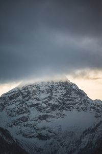 Scenic view of snowcapped mountains against sky at night