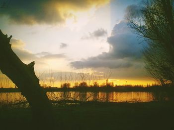 Scenic view of lake at sunset