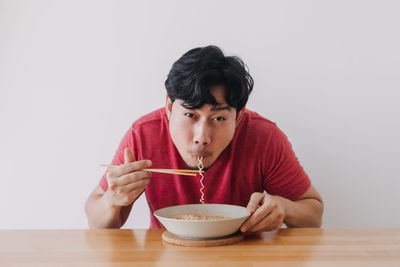 Portrait of mid adult man sitting in bowl