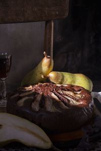 Close-up of pears and cake on table