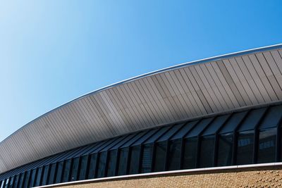 Low angle view of building against clear blue sky