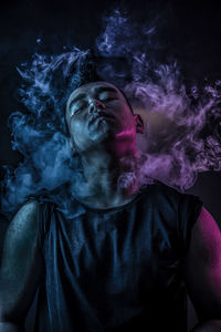 Digital composite image of man smoking