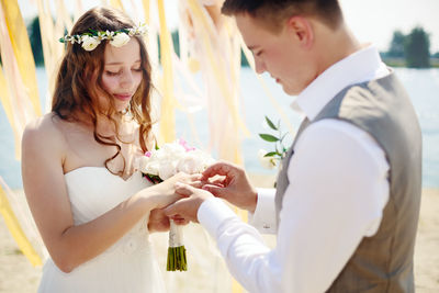 Couple holding flower bouquet