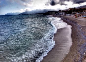 Scenic view of sea against cloudy sky