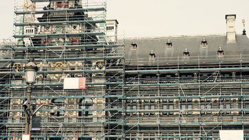 Low angle view of construction site against sky