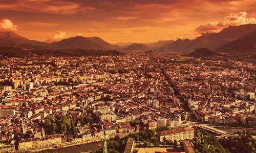 High angle shot of townscape against sky during sunset