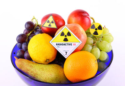 Close-up of apples and fruits on white background