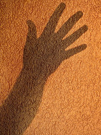 High angle view of shadow on sand