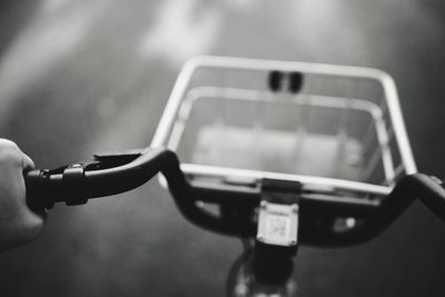 Close-up of hand holding vehicle on road