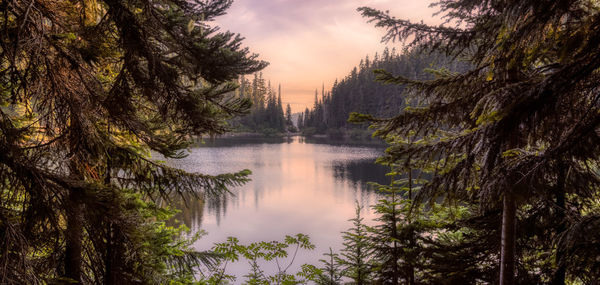 Scenic view of lake against sky at sunset