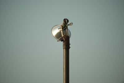 Low angle view of street light against sky
