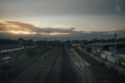 High angle view of railroad tracks against sky at sunset