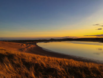 Scenic view of sea at sunset