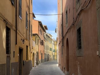 Narrow alley amidst buildings in town