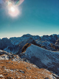 Scenic view of snowcapped mountains against clear sky