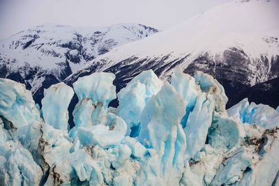 Moreno glacier with snowcapped mountains in background