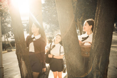 Rear view of woman looking at camera