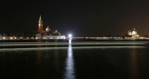 Illuminated buildings at waterfront