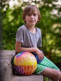 Portrait of cute boy with ball