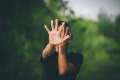 Midsection of woman standing in park