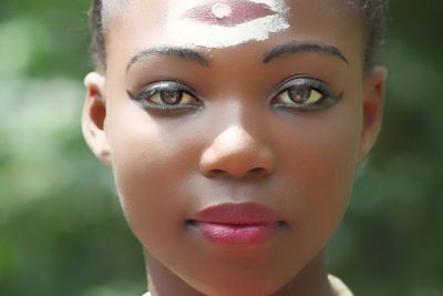 Close-up portrait of woman wearing make-up