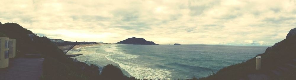 Scenic view of sea against cloudy sky