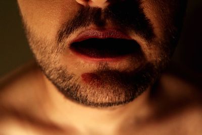Midsection of man with lipstick and stubble