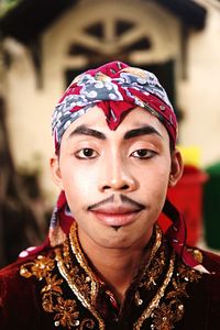 Close-up portrait of man in traditional clothing