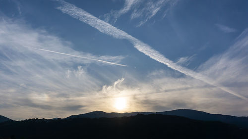 Low angle view of silhouette mountains against sky during sunset