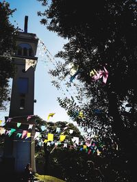 Low angle view of flags against sky