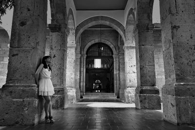 Full length of woman standing on doorway