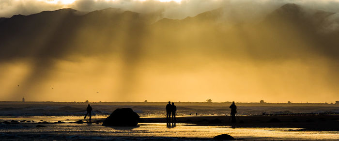 Scenic view of sea at sunset