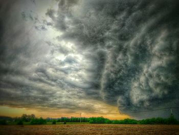 Scenic view of landscape against cloudy sky