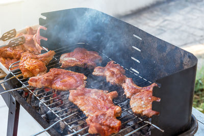 Bbq ribs. ribs fried over an open fire. fire and smoke roll meat