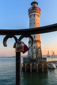 Low angle view of padlocks against built structure