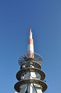 Low angle view of communications tower against sky