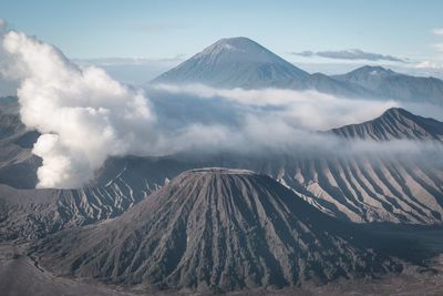 Panoramic view of volcanic mountain range against sky