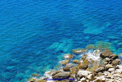 High angle view of rocks and sea