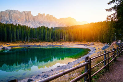 Scenic view of lake against sky during sunset