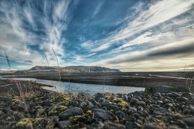 Scenic view of sea against cloudy sky
