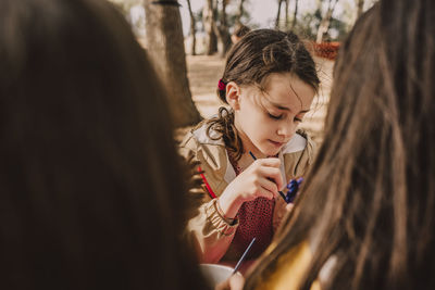 Full length of woman with arms raised