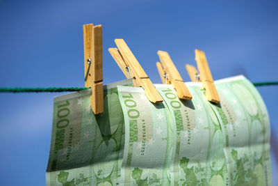 100 euro banknotes on a clothesline. money laundering theme.