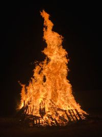 Bonfire on field at night